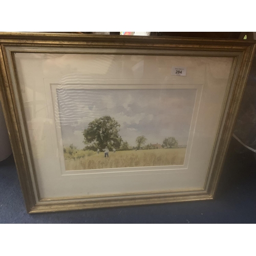 284 - A FRAMED PICTURE OF A HARVEST SCENE
