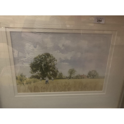 284 - A FRAMED PICTURE OF A HARVEST SCENE