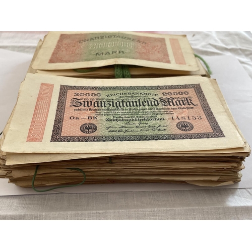 393 - A FOLDER CONTAINING A LARGE QUANTITY OF 1923 ZWANZIGTAUSEND MARK GERMAN BANK NOTES