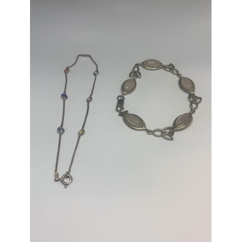 523 - TWO SILVER BRACELETS - ONE CELTIC DESUGN WITH PALE PINK STONES AND ONE WITH VARIOUS COLOURED STONES ... 