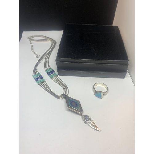 530 - A SILVER NAVAJO NECKLACE WITH FEATHER DESIGN AND A SILVER RING WITH NAVAJO STONE WITH A PRESENTATION... 