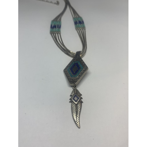 530 - A SILVER NAVAJO NECKLACE WITH FEATHER DESIGN AND A SILVER RING WITH NAVAJO STONE WITH A PRESENTATION... 
