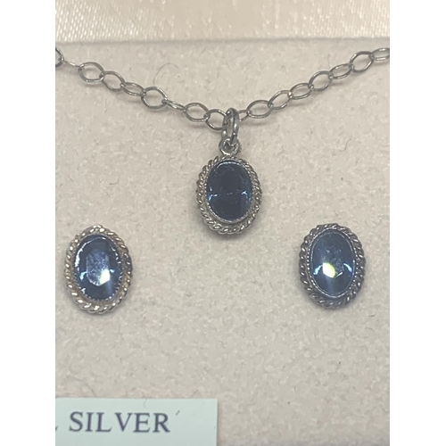 531 - A BOXED SILVER NECKLACE AND EARRING SET WITH BLUE STONES SURROUNDED BY CLEAR STONE CHIPS