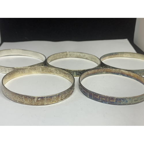 567 - FIVE SILVER BANGLES WITH VARIOUS DESIGNS