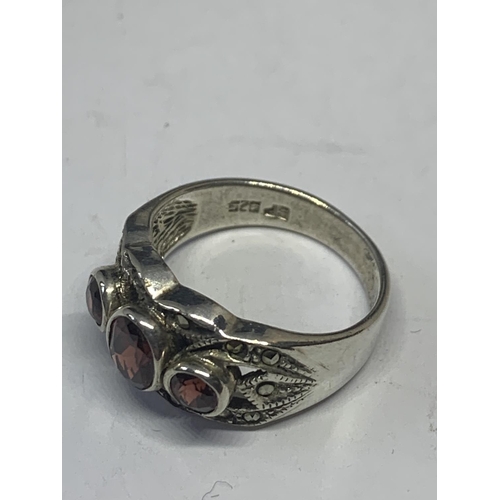 569 - A SILVER AND THREE STONE RING WITH PRESENTATION BOX