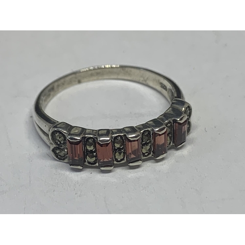 571 - A SLIVER RING WITH FIVE IN LINE AMBER COLOURED STONES IN A PRESENTATION BOX