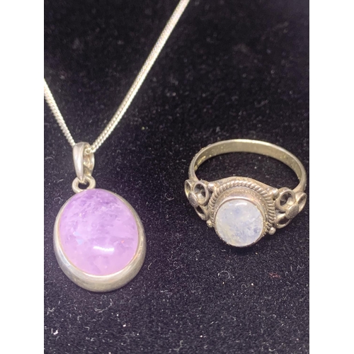 576 - A SILVER NECKLACE WITH PURPLE STONE PENDANT AND A SILVER RING WITH STONE IN A PRESENTATION BOX