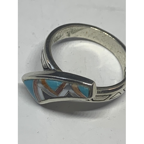 581 - A SILVER RING WITH A NAVAJO STONE DESIGN IN A PRESENTATION BOX