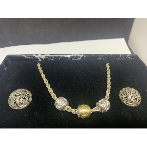 585 - A SILVER NECKLACE, BRACELET AND EARRING SET IN A PRESENTATION BOX