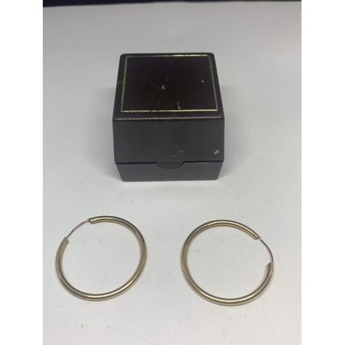 592 - A PAIR OF 9 CARAT GOLD HOOP EARRINGS IN A PRESENTATION BOX