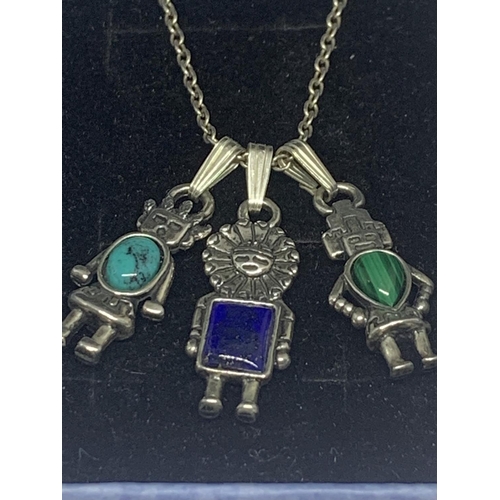 595 - A SILVER NECKLACE WITH THREE ROBOT PENDANTS IN A PRESENTATION BOX