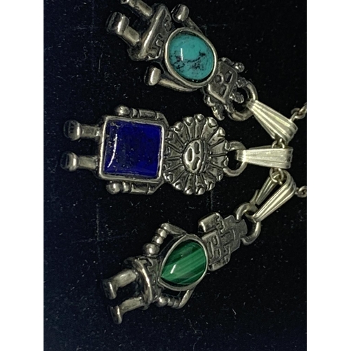 595 - A SILVER NECKLACE WITH THREE ROBOT PENDANTS IN A PRESENTATION BOX