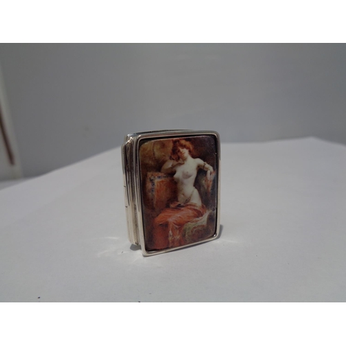 618 - A MARKED SILVER PILL BOX WITH AN ENAMEL EROTIC DESIGN TOP