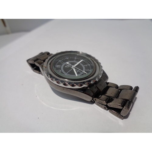 624 - A WRIST WATCH SEEN WORKING BUT NO WARRANTY