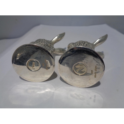 629 - A PAIR OF HEAVY SILVER PLATED HARE DESIGN SALT POTS