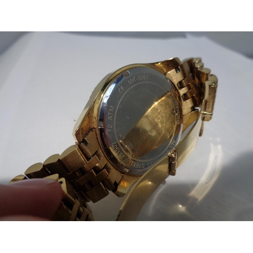 638 - A GILT CHRONOGRAPH FASHION WATCH SEEN WORKING BUT NO WARRANTY