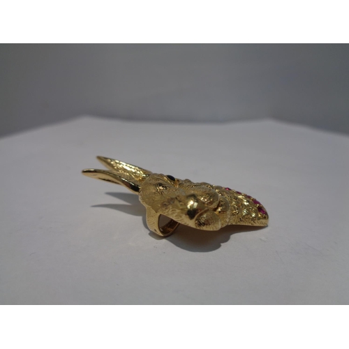 648 - A SILVER GILT PENDANT IN THE FORM OF A HARE WITH A PINK STONE COLLAR