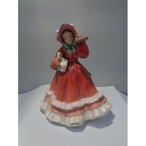 716 - A ROYAL DOULTON FIGURINE CHRISTMAS TIME HN2110