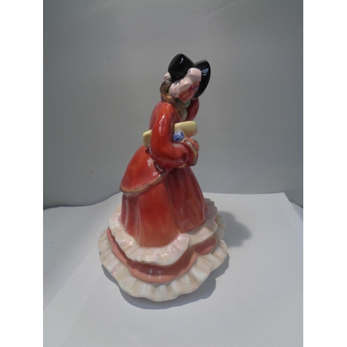 716 - A ROYAL DOULTON FIGURINE CHRISTMAS TIME HN2110