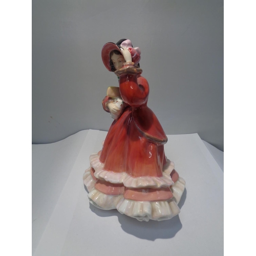 716 - A ROYAL DOULTON FIGURINE CHRISTMAS TIME HN2110