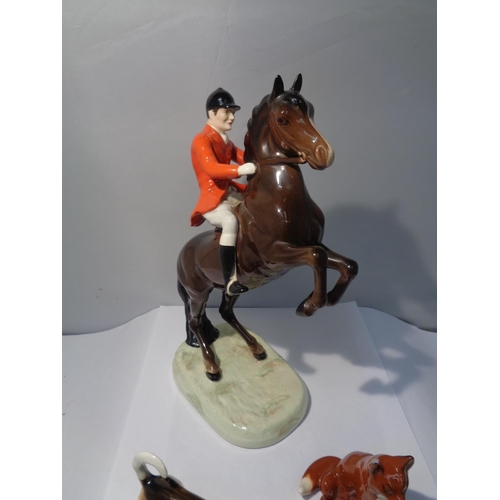 720 - A BESWICK REARING BAY HORSE HUNTSMAN WITH A FOX AND A HOUND