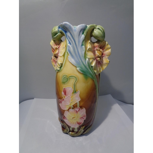 741 - A DECORATIVE VASE WITH FLOWER DESIGN