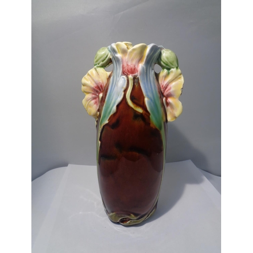 741 - A DECORATIVE VASE WITH FLOWER DESIGN