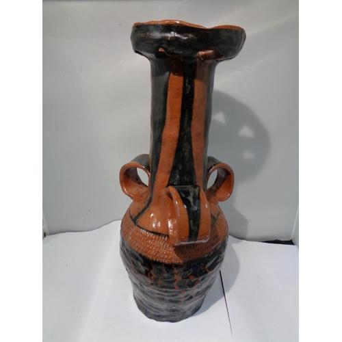 748 - A LARGE MIDDLE EASTERN, POSSIBLY TURKISH, POTTERY TRI HANDLDED WINE VESSEL, HEIGHT 39 CM