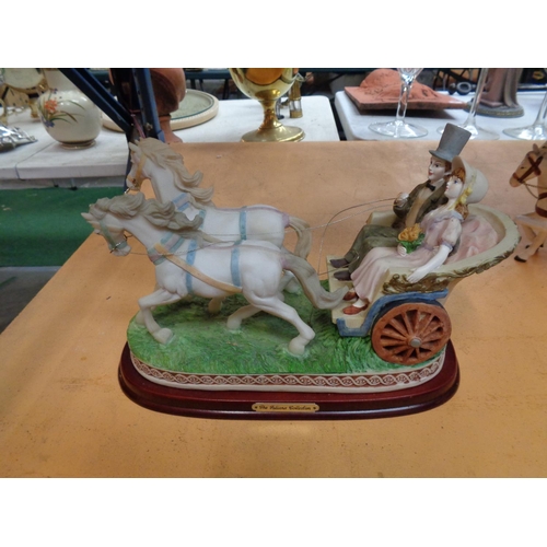 753 - A JULIANNA COUPLE IN A CARRIAGE WITH HORSES N A WOODEN BASE AND A SECOND HORSE DRAWN CARRIAGE WITH C... 