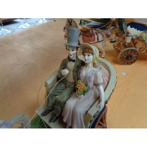 753 - A JULIANNA COUPLE IN A CARRIAGE WITH HORSES N A WOODEN BASE AND A SECOND HORSE DRAWN CARRIAGE WITH C... 