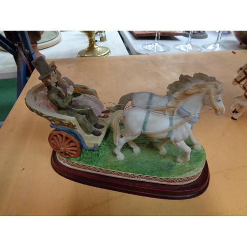 753 - A JULIANNA COUPLE IN A CARRIAGE WITH HORSES N A WOODEN BASE AND A SECOND HORSE DRAWN CARRIAGE WITH C... 