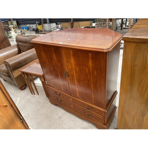 2443 - A YEW WOOD TV CABINET AND A NEST OF TABLES