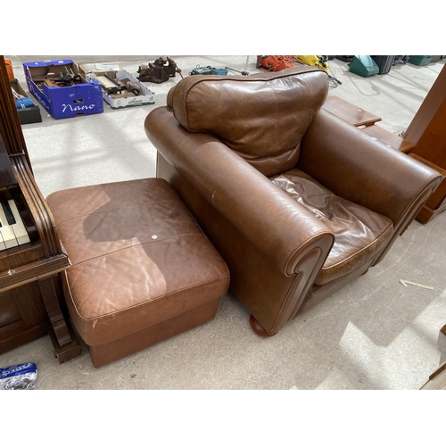 2444 - A MODERN LEATHER EASY CHAIR ON BUN FEET AND FOOTSTOOL WITH HINGED LID