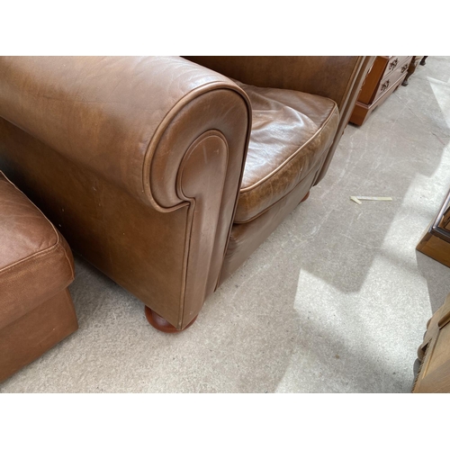 2444 - A MODERN LEATHER EASY CHAIR ON BUN FEET AND FOOTSTOOL WITH HINGED LID