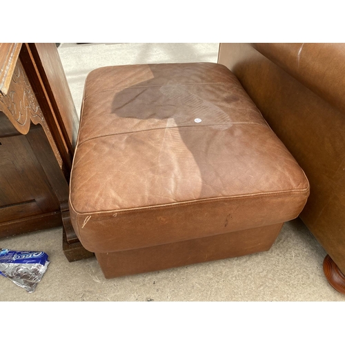 2444 - A MODERN LEATHER EASY CHAIR ON BUN FEET AND FOOTSTOOL WITH HINGED LID