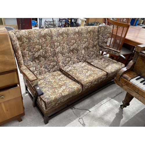 2448 - A PARKER KNOLL STYLE WINGED THREE SEATER COTTAGE SETTEE