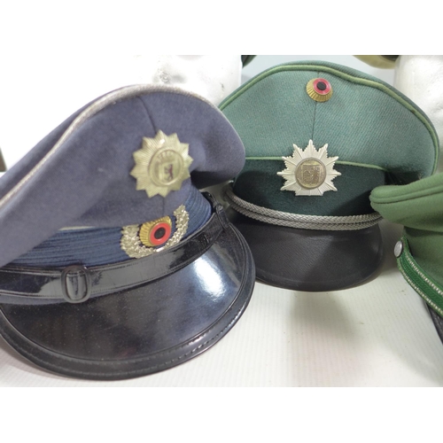 326 - FIVE GERMAN/AUSTRIAN POLICE HATS