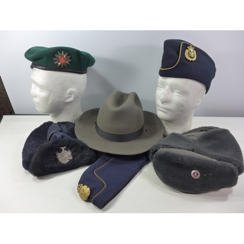 329 - SIX ASSORTED POLICE HATS ETC TO INCLUDE EXCELSIOR, RUSSIAN, CONTINENTAL ETC