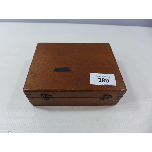 389 - A CASED COMPASS AND STAND ATTACHMENTS, FACE DIAMETER 8CM