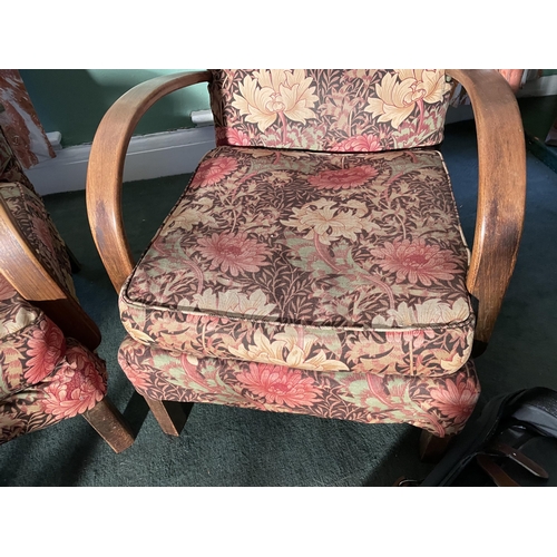 2963 - TWO OAK FRAMED ARMCHAIRS WITH FLORAL UPHOLSTERY