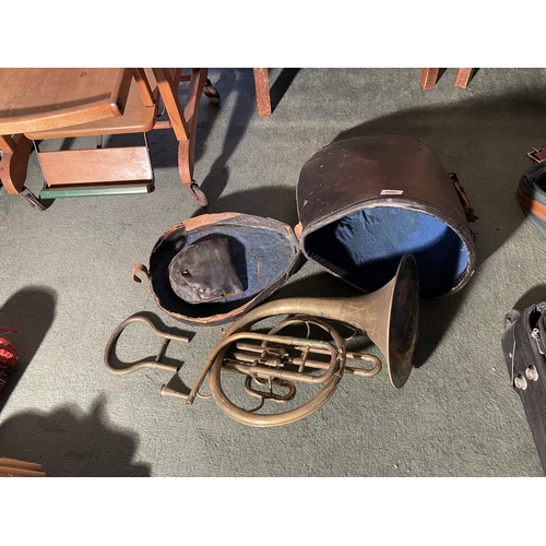 2968 - A BRASS FRENCH HORN WITH A LEATHER CASE