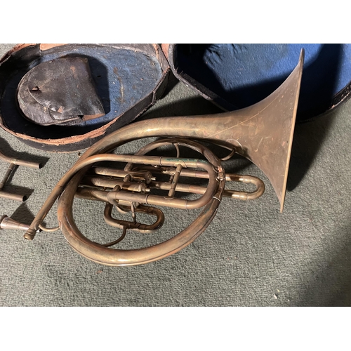 2968 - A BRASS FRENCH HORN WITH A LEATHER CASE