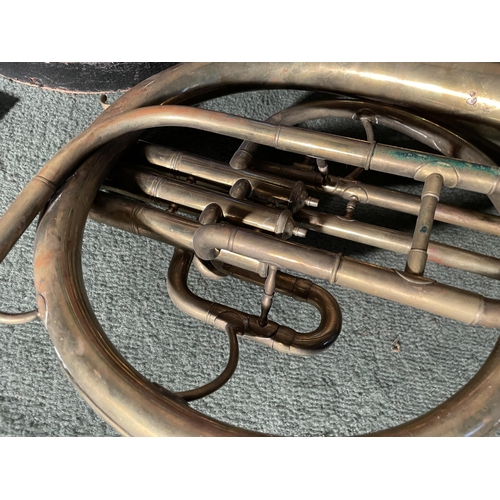 2968 - A BRASS FRENCH HORN WITH A LEATHER CASE