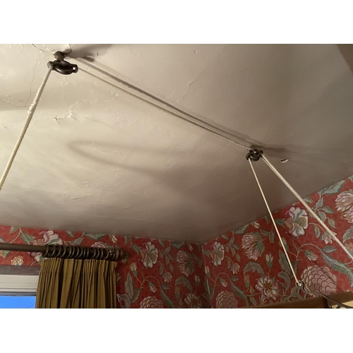 2973 - A CEILING SUSPENDED CAST IRON AND PINE CLOTHES AIRER