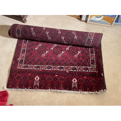 2974 - A RED PATTERNED RUG