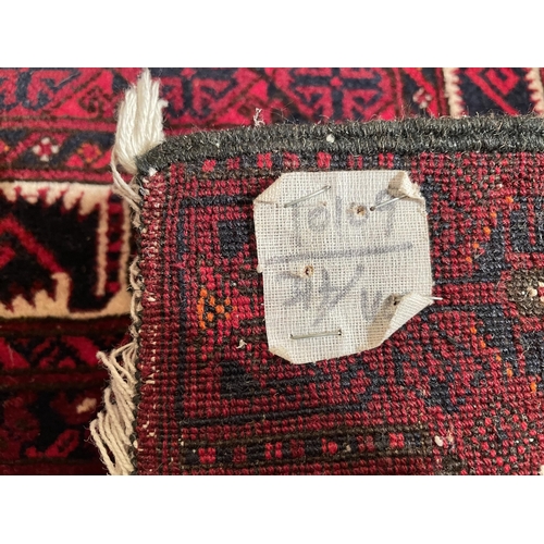 2974 - A RED PATTERNED RUG