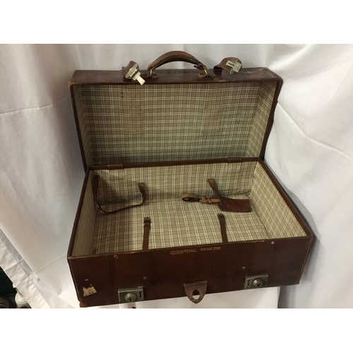 6 - A THE MARTIN WITH EVERLASTING SPRINGS LEATHER SUITCASE STAMPED H W FIDDAMAN WITH LABELS TO INCLUDE P... 