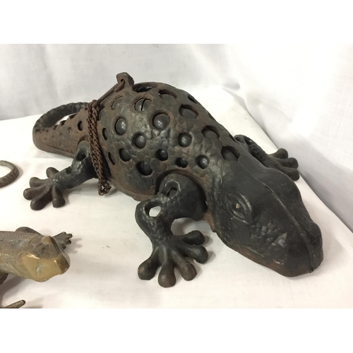 22 - A HEAVY OUTDOOR HANGING TEA LIGHT HOLDER IN THE FORM OF A KOMODO DRAGON WITH GLASS SPOT DETAILING TO... 