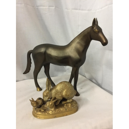 24 - A HEAVY BRONZE EFFECT METAL HORSE FIGURINE, HEIGHT 30CM, WIDTH APPROX 41CM, TOGETHER WITH A BRASS TR... 