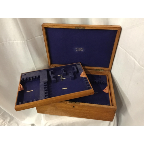 25 - A LARGE THREE LEVEL OAK CANTEEN OF CUTLERY  BOX WITH BRASS HANDLES AND TWO KEYS, BRASS PRESENTATION ... 